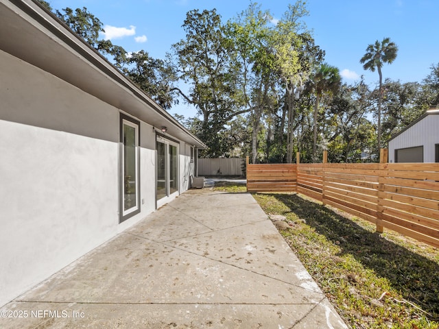 5062 N Ocean Shore Blvd, Palm Coast, FL 32137 - view of patio with a garage