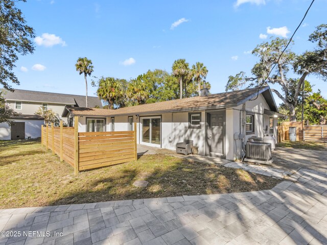 5062 N Ocean Shore Blvd, Palm Coast, FL 32137 - view of front facade featuring a shingled roof and stucco siding