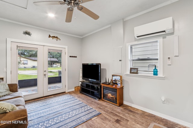 86759 Hester Dr, Yulee, FL 32097 - living room featuring an AC wall unit, wood finished floors, french doors, ornamental molding, and ceiling fan