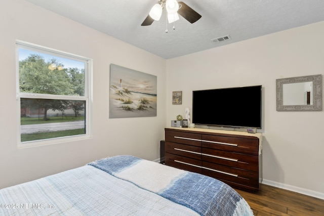 86759 Hester Dr, Yulee, FL 32097 - bedroom with dark wood finished floors and ceiling fan