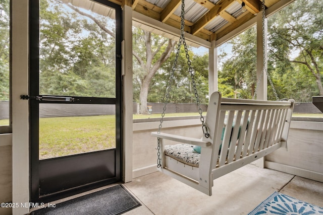 86759 Hester Dr, Yulee, FL 32097 - sunroom featuring view of wooded area and beamed ceiling
