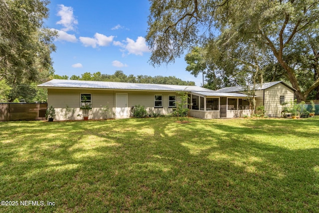 86759 Hester Dr, Yulee, FL 32097 - rear view of house featuring a sunroom and a metal roof