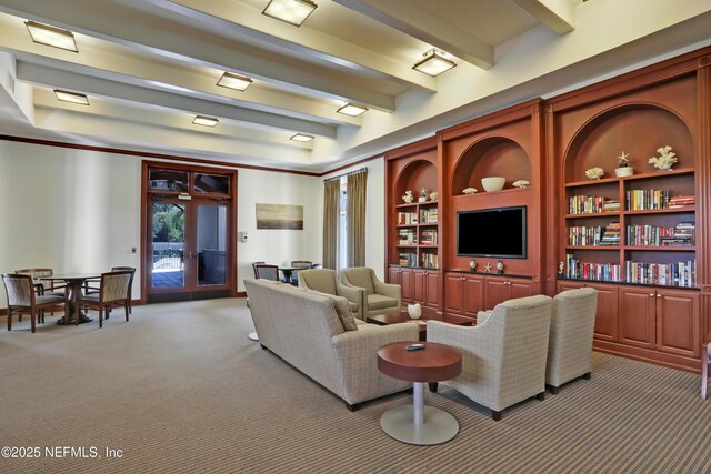 14402 Marina San Pablo Pl Unit 203, Jacksonville, FL 32224 - living room featuring light colored carpet, beamed ceiling, and built in shelves