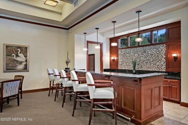 14402 Marina San Pablo Pl Unit 203, Jacksonville, FL 32224 - bar area featuring decorative backsplash and decorative light fixtures