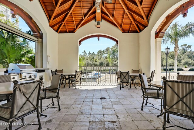 14402 Marina San Pablo Pl Unit 203, Jacksonville, FL 32224 - view of patio / terrace with outdoor dining area and an outdoor kitchen