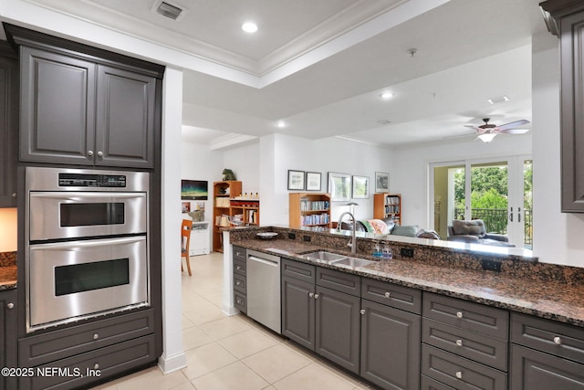 14402 Marina San Pablo Pl Unit 203, Jacksonville, FL 32224 - kitchen with appliances with stainless steel finishes, light tile patterned floors, dark stone countertops, a ceiling fan, and recessed lighting