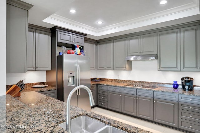 14402 Marina San Pablo Pl Unit 203, Jacksonville, FL 32224 - kitchen with black electric cooktop, stainless steel refrigerator with ice dispenser, gray cabinetry, under cabinet range hood, and crown molding