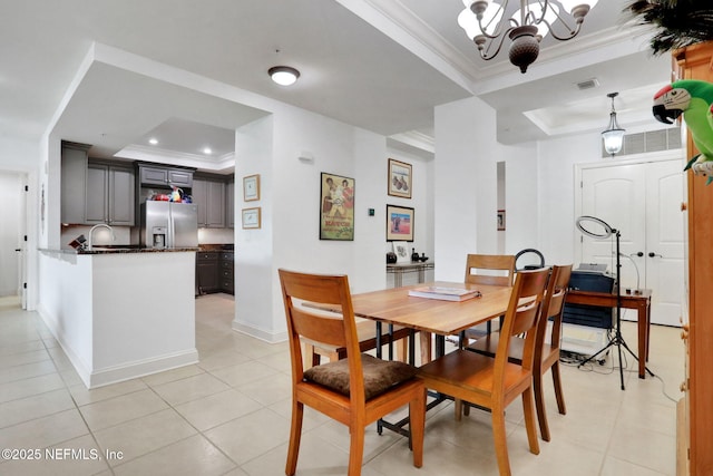 14402 Marina San Pablo Pl Unit 203, Jacksonville, FL 32224 - dining space with a tray ceiling, ornamental molding, light tile patterned floors, a chandelier, and recessed lighting