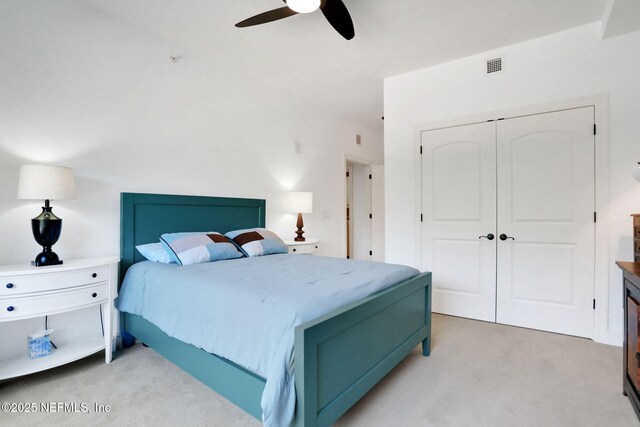 14402 Marina San Pablo Pl Unit 203, Jacksonville, FL 32224 - bedroom featuring light carpet, a closet, and a ceiling fan