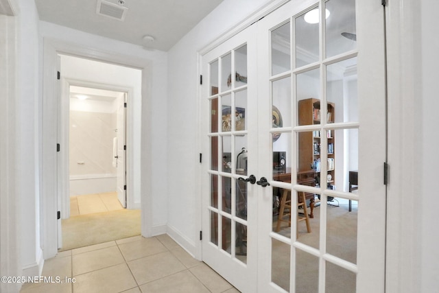 14402 Marina San Pablo Pl Unit 203, Jacksonville, FL 32224 - hall with french doors and tile patterned floors