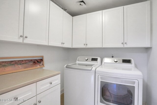 14402 Marina San Pablo Pl Unit 203, Jacksonville, FL 32224 - laundry area featuring washer and clothes dryer and cabinet space