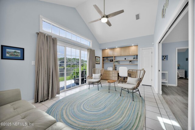 107 Hammock Cir, Saint Augustine, FL 32084 - sitting room with high vaulted ceiling, ceiling fan, light tile patterned floors, and plenty of natural light