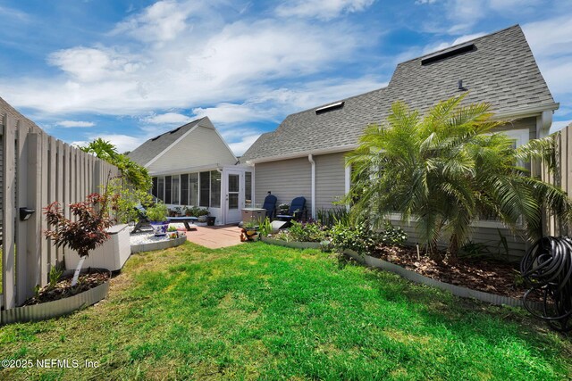 107 Hammock Cir, Saint Augustine, FL 32084 - rear view of property featuring roof with shingles, a patio, and a fenced backyard