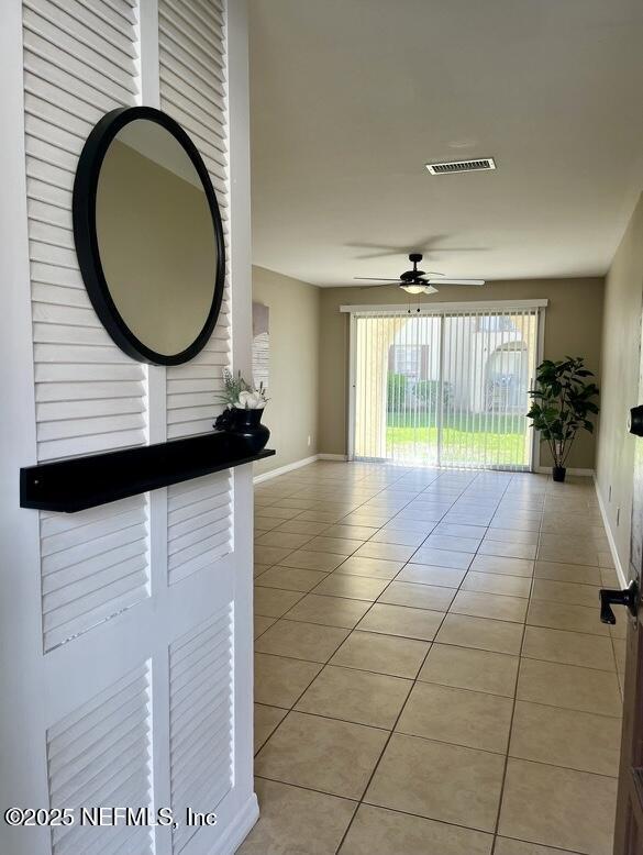 1713 El Camino Rd Unit 3, Jacksonville, FL 32216 - unfurnished room featuring light tile patterned flooring and a ceiling fan