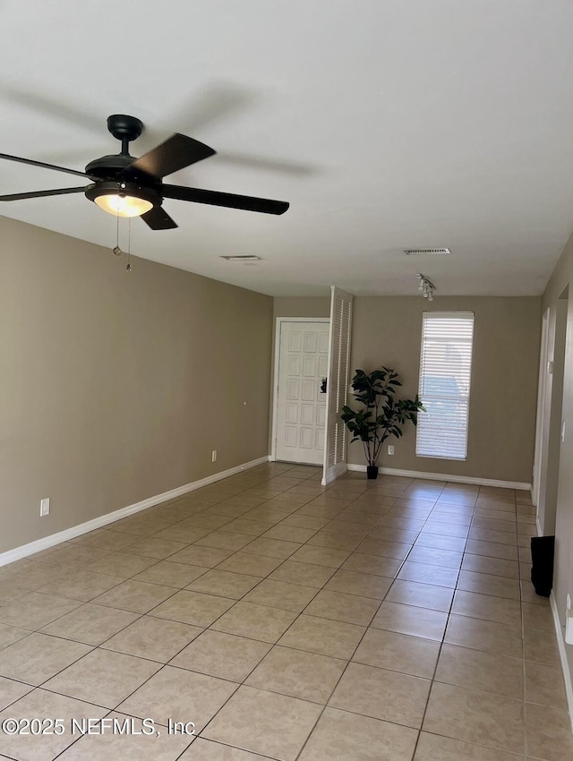 1713 El Camino Rd Unit 3, Jacksonville, FL 32216 - unfurnished room featuring ceiling fan and light tile patterned flooring
