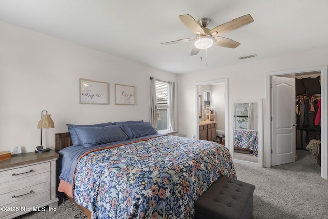 4433 Warm Springs Way, Middleburg, FL 32068 - bedroom featuring a walk in closet, carpet floors, ensuite bathroom, a closet, and a ceiling fan