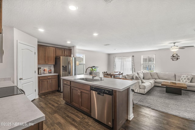 4433 Warm Springs Way, Middleburg, FL 32068 - kitchen featuring appliances with stainless steel finishes, open floor plan, dark wood-type flooring, light countertops, and recessed lighting