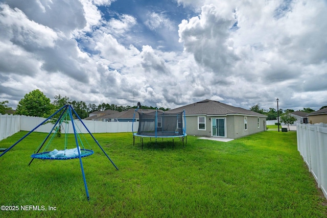 4433 Warm Springs Way, Middleburg, FL 32068 - fenced backyard featuring a trampoline and a playground