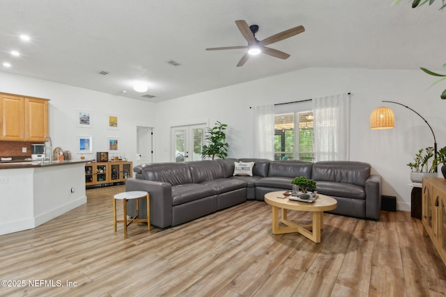 13967 Devan Lee Dr N, Jacksonville, FL 32226 - living room with light wood-style flooring, lofted ceiling, and ceiling fan