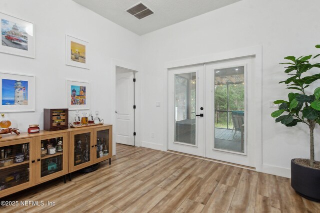 13967 Devan Lee Dr N, Jacksonville, FL 32226 - sitting room with french doors and wood finished floors