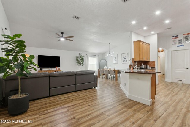 13967 Devan Lee Dr N, Jacksonville, FL 32226 - living room featuring ceiling fan, recessed lighting, and light wood-style floors