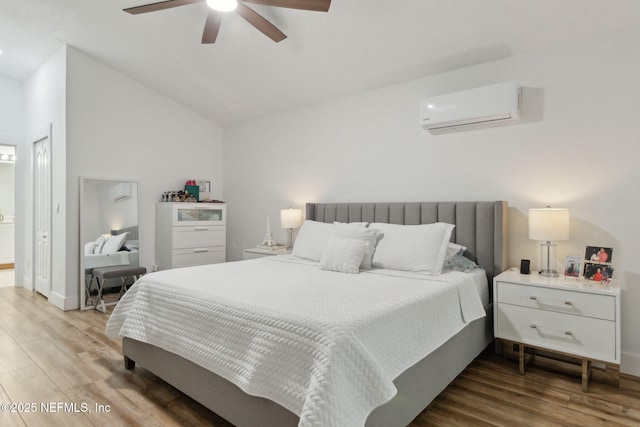13967 Devan Lee Dr N, Jacksonville, FL 32226 - bedroom featuring a wall mounted AC, wood finished floors, lofted ceiling, and a ceiling fan