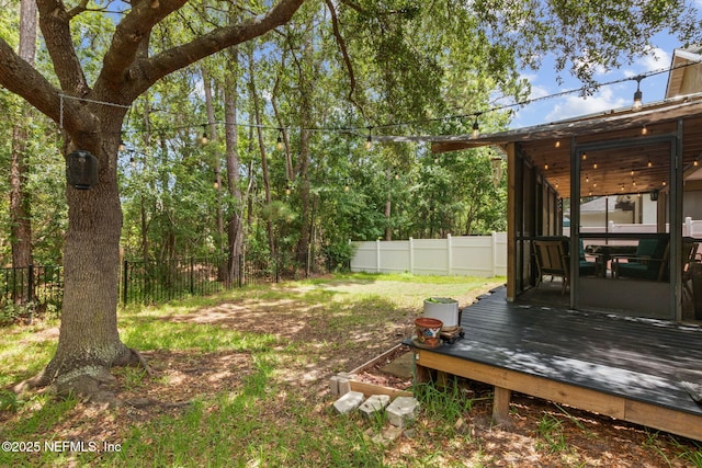 13967 Devan Lee Dr N, Jacksonville, FL 32226 - fenced backyard with a wooden deck and a sunroom