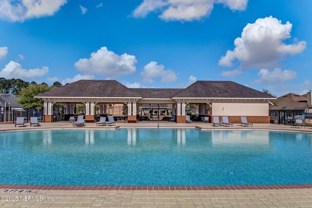 13967 Devan Lee Dr N, Jacksonville, FL 32226 - community pool featuring a gazebo and a patio