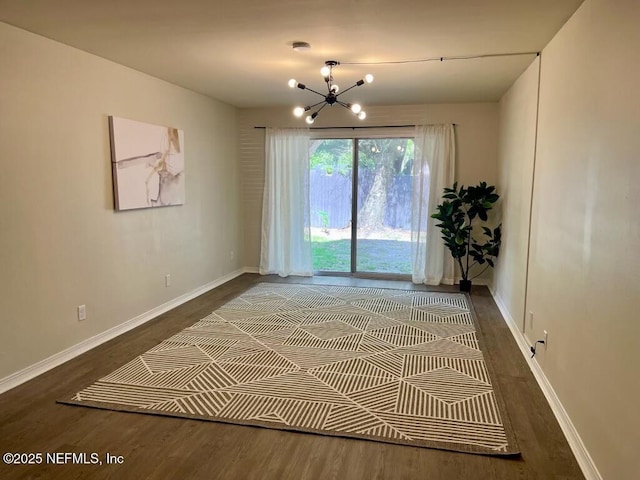1716 El Camino Rd Unit 3, Jacksonville, FL 32216 - unfurnished room with a chandelier and wood finished floors
