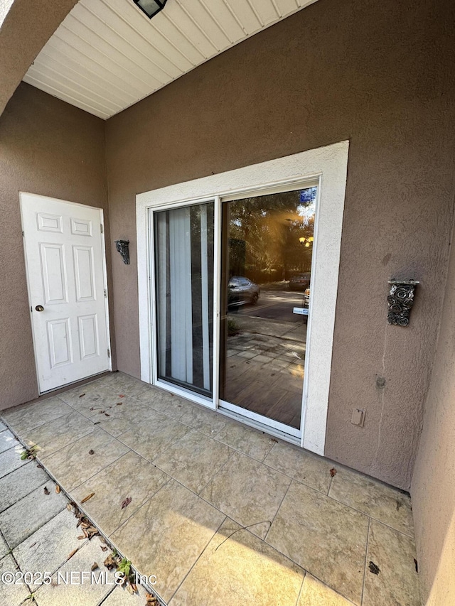 9626 Belda Way Unit 7, Jacksonville, FL 32257 - view of exterior entry with stucco siding