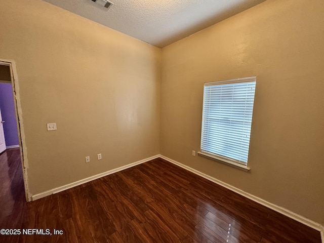 9626 Belda Way Unit 7, Jacksonville, FL 32257 - empty room featuring dark wood-style flooring and baseboards