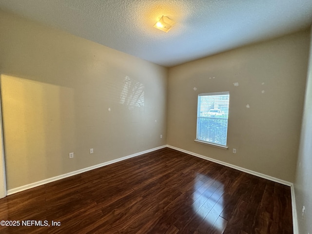 9626 Belda Way Unit 7, Jacksonville, FL 32257 - unfurnished room with wood finished floors and a textured ceiling