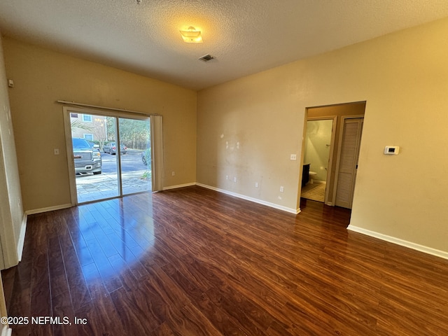 9626 Belda Way Unit 7, Jacksonville, FL 32257 - unfurnished room featuring dark wood finished floors and a textured ceiling