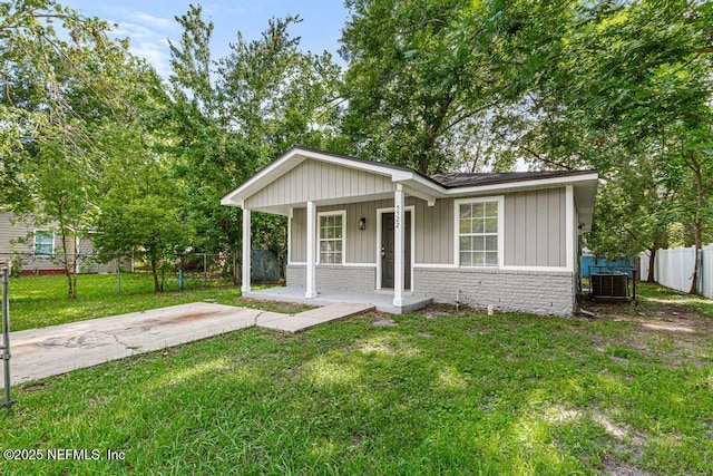 5522 Paris Ave, Jacksonville, FL 32209 - view of front of property featuring covered porch, board and batten siding, and brick siding