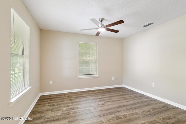 5522 Paris Ave, Jacksonville, FL 32209 - unfurnished room with plenty of natural light, wood finished floors, and ceiling fan