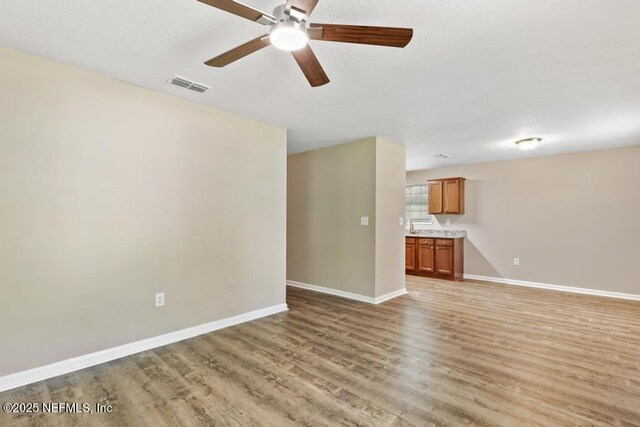 5522 Paris Ave, Jacksonville, FL 32209 - unfurnished living room with ceiling fan and light wood-style flooring