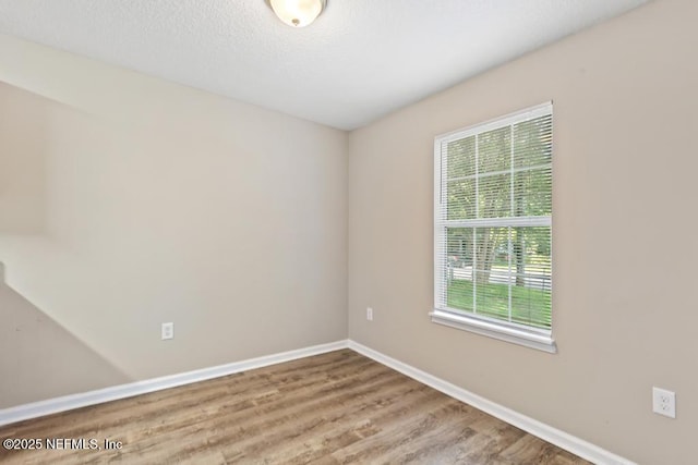 5522 Paris Ave, Jacksonville, FL 32209 - spare room featuring wood finished floors and baseboards