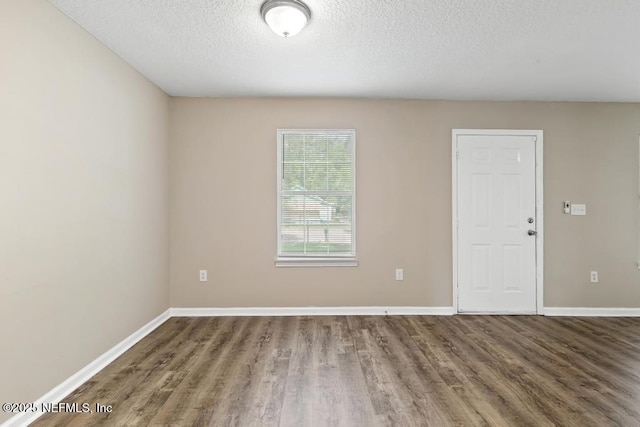 5522 Paris Ave, Jacksonville, FL 32209 - unfurnished room featuring wood finished floors and a textured ceiling