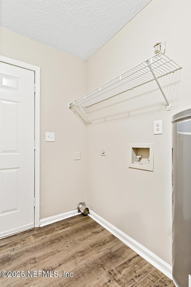 5522 Paris Ave, Jacksonville, FL 32209 - washroom with washer hookup, wood finished floors, electric dryer hookup, and a textured ceiling