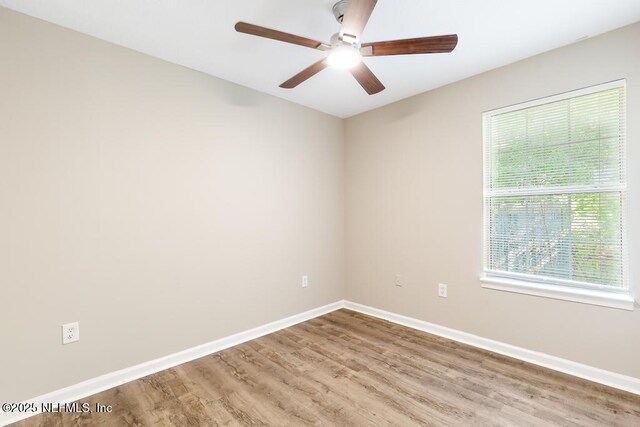 5522 Paris Ave, Jacksonville, FL 32209 - spare room with wood finished floors and a ceiling fan