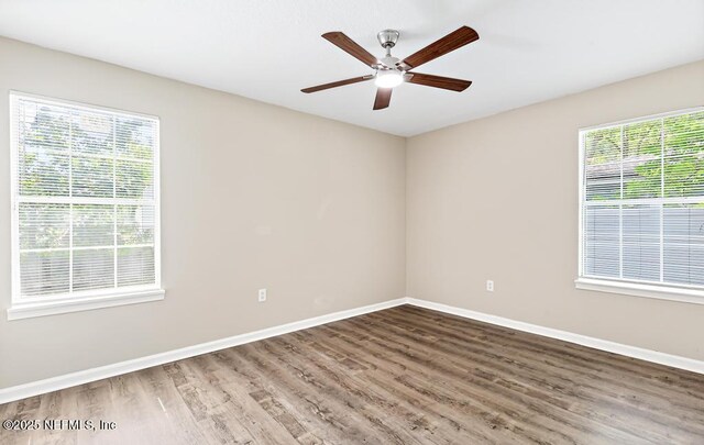 5522 Paris Ave, Jacksonville, FL 32209 - empty room with wood finished floors and a ceiling fan