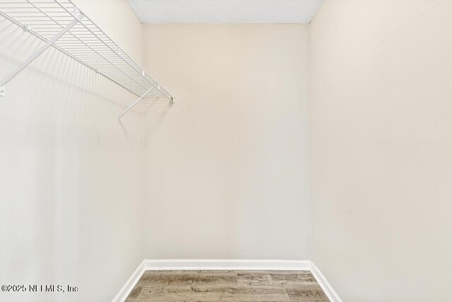 5522 Paris Ave, Jacksonville, FL 32209 - walk in closet with wood finished floors