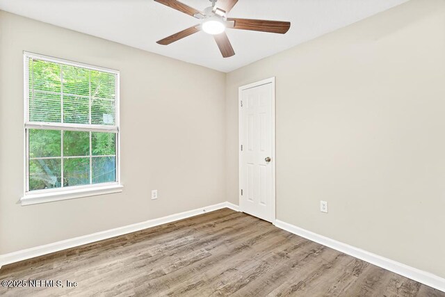 5522 Paris Ave, Jacksonville, FL 32209 - empty room with a ceiling fan and wood finished floors