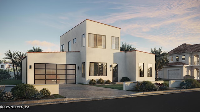 30 Bermuda Run Way, Saint Augustine Beach, FL 32080 - contemporary house featuring asphalt driveway, stucco siding, and a garage