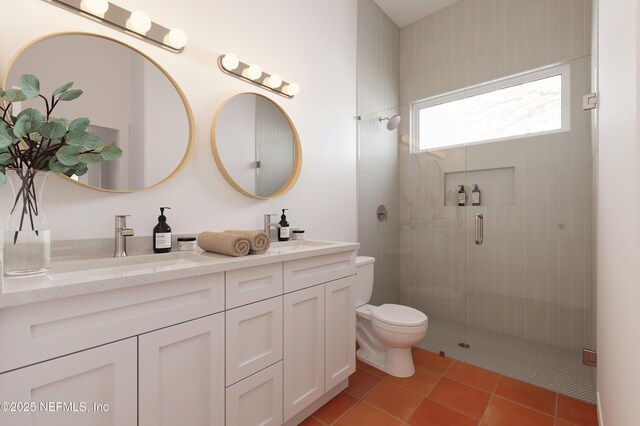 30 Bermuda Run Way, Saint Augustine Beach, FL 32080 - bathroom featuring double vanity, a tile shower, and tile patterned flooring