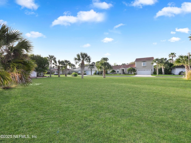 30 Bermuda Run Way, Saint Augustine Beach, FL 32080 - view of grassy yard featuring an attached garage