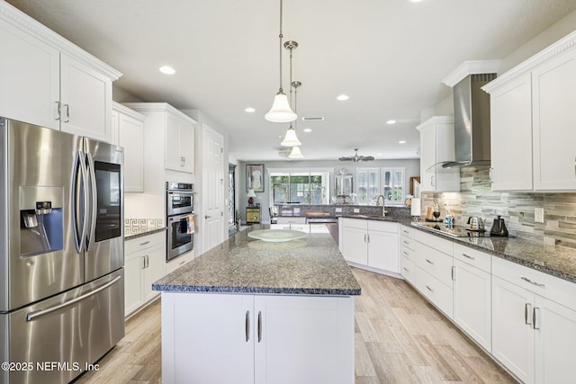 435 Tree Side Ln, Ponte Vedra, FL 32081 - kitchen featuring appliances with stainless steel finishes, wall chimney range hood, recessed lighting, white cabinetry, and tasteful backsplash
