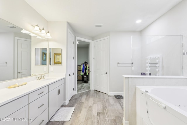 435 Tree Side Ln, Ponte Vedra, FL 32081 - full bathroom featuring vanity, wood finished floors, a bath, and a closet