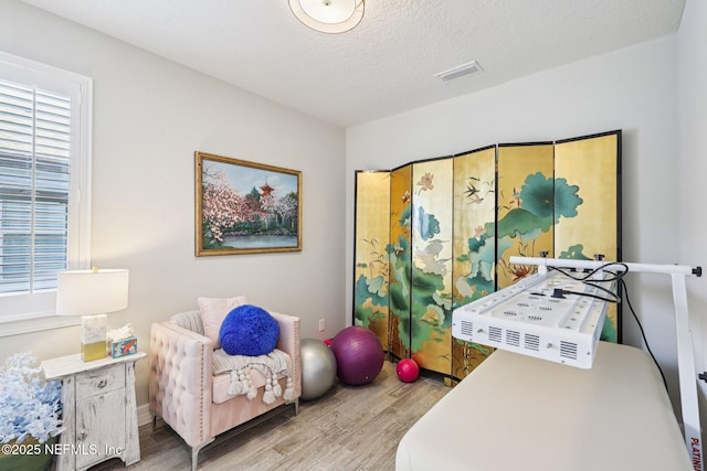 435 Tree Side Ln, Ponte Vedra, FL 32081 - bedroom with wood finished floors and a textured ceiling