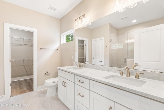 6334 Salado Rd, Saint Augustine, FL 32080 - full bath with double vanity, a shower stall, and a spacious closet